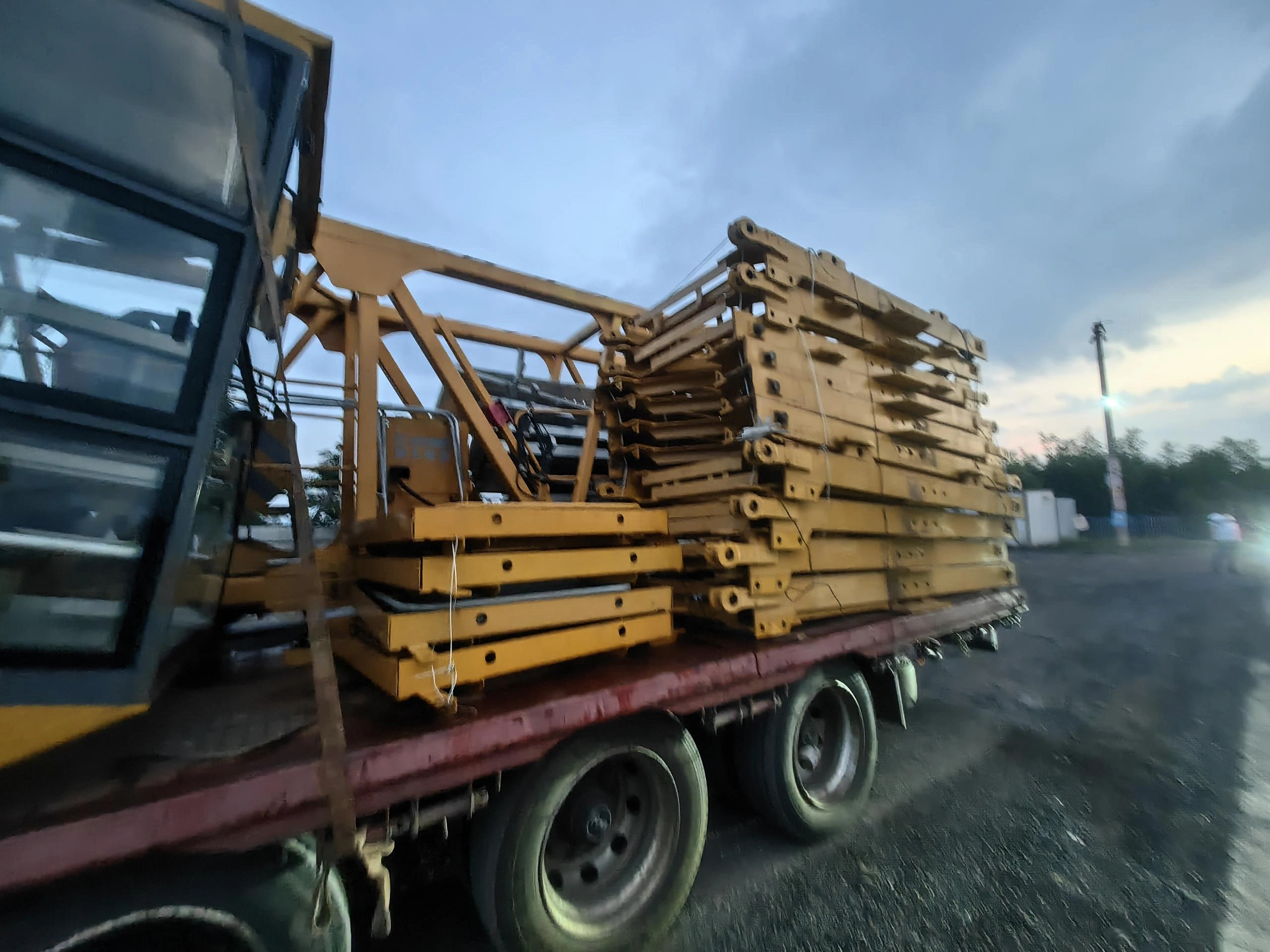 Crane components stacked on a road trailer